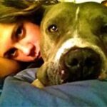 dog and person laying together.